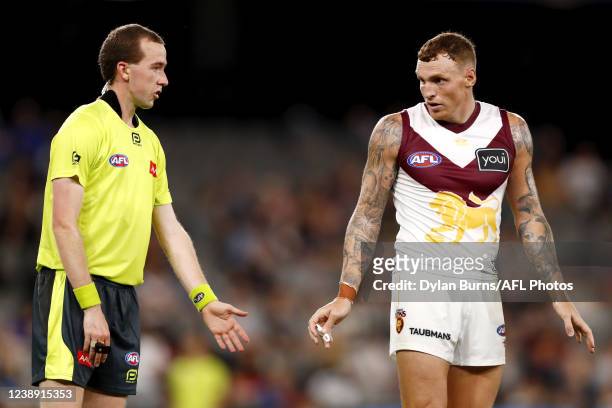 Mitch Robinson of the Lions speaks with the umpire during the 2022 AFL Community Series match between the Western Bulldogs and the Brisbane Lions at...