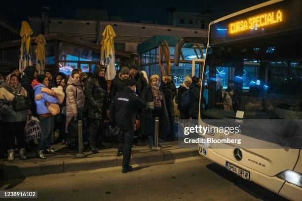 Displaced Ukrainians prepare to take buses to temporary housing after travelling by train from Iasi, a Romanian city near the Moldovan border, at the...