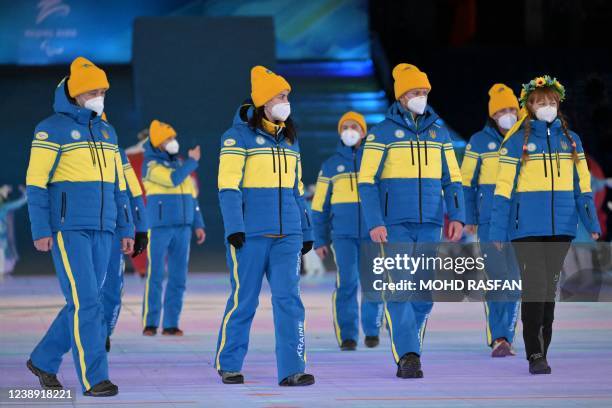 Athletes from Ukraine take part in the opening ceremony of the Beijing 2022 Winter Paralympic Games at the National Stadium in Beijing on March 4,...