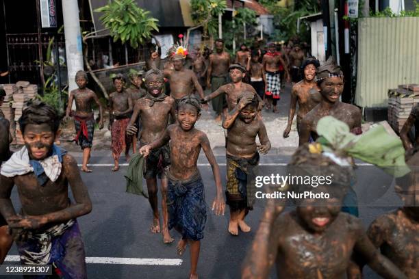 The Day after Nyepi , the indigenous people of Kedonganan village, Bali held a ritual with mud called ''Mabuug-buugan'' on Friday, March 4, 2022....