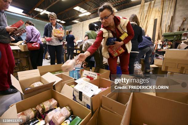 Volunteers organise supplies collected from around the country before sending them to Poland for Ukrainian refugees, following Russia's invasion of...