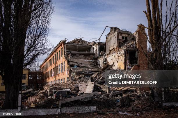 This photograph taken on March 4, 2022 shows a school building damaged in yesterday's shelling in the city of Chernihiv. - Fourty-seven people died...