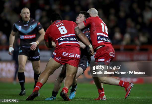 St Helens' Jack Welsby tackled Hull KR's Albert Vete and George King during the Betfred Super League match at Sewell Group Craven Park, Kingston upon...