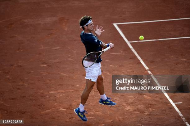 Brazilian tennis player Thiago Seyboth Wild returns the ball during a Davis Cup tennis match against German Alexander Zverev at the Rio 2016 Olympic...