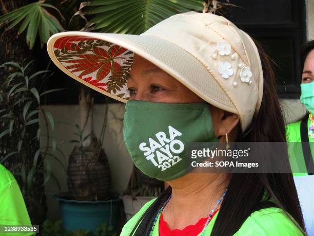 Supporter wears a facemask with SARA TAYO 2022 imprint on it. Presidential daughter and Davao City Mayor Sara Duterte-Carpio visit Navotas City. It...