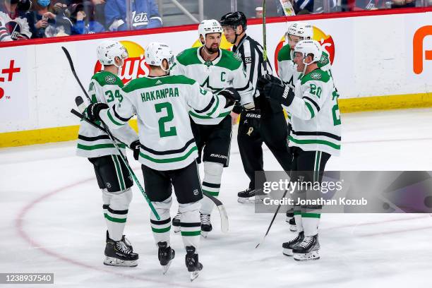 Denis Gurianov, Jani Hakanpaa, Jamie Benn, Ryan Suter and Jason Robertson of the Dallas Stars celebrate a third period goal against the Winnipeg Jets...