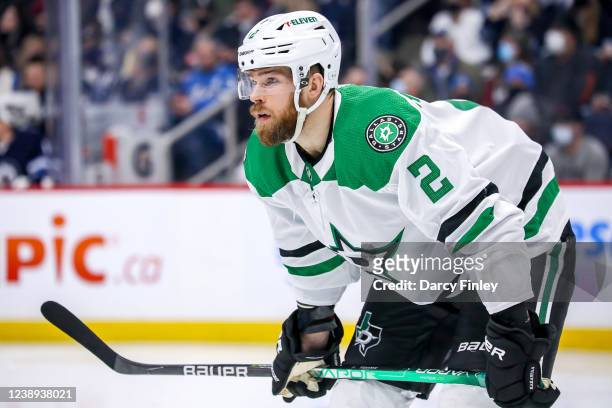 Jani Hakanpaa of the Dallas Stars gets set during a second period face-off against the Winnipeg Jets at the Canada Life Centre on March 4, 2022 in...