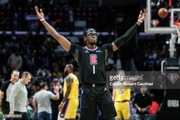 Los Angeles, CA, Thursday, March 3, 2022 - LA Clippers guard Reggie Jackson encourages fans to cheer as he leads the Clippers to a 132-111 win over...