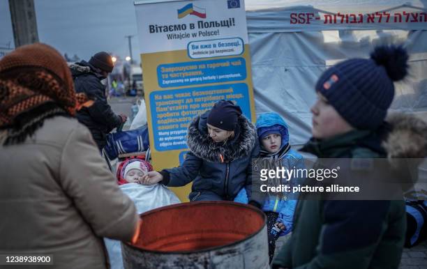 March 2022, Poland, Medyka: Ira waits at the Ukrainian-Polish border in Medyka to be picked up by a relative from the Czech Republic with her...