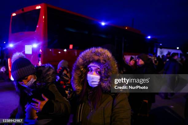 People fleeing from Ukraine are seen after crossing Ukrainian-Polish border due to Russian military attack on Ukraine. Medyka, Poland on March 4,...