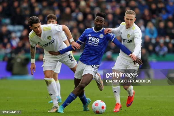 Leicester City's Nigerian midfielder Wilfred Ndidi vies with Leeds United's German defender Robin Koch and Leeds United's English midfielder Adam...