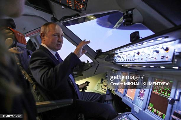 Russian President Vladimir Putin gestures during his visit to Aeroflot aviation training complex outside Moscow on March 5, 2022. - Russian President...