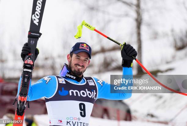 Winner Italy's Dominik Paris cheers on his way to the podium after the men's downhill competition of the World Cup in alpine skiing in Kvitfjell on...