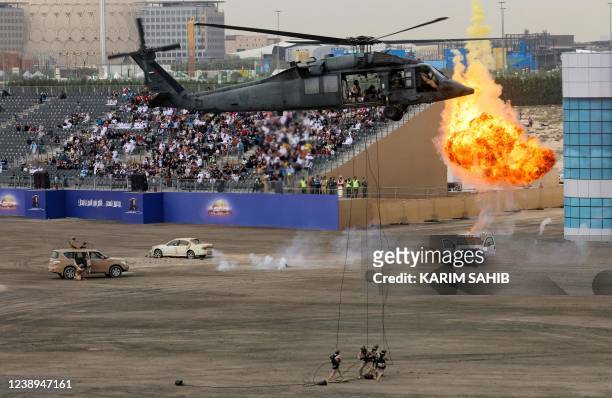 Soldiers and military helicopters from the United Arab Emirates Armed Forces demonstrate their skills during the Union Fortress 8 military...