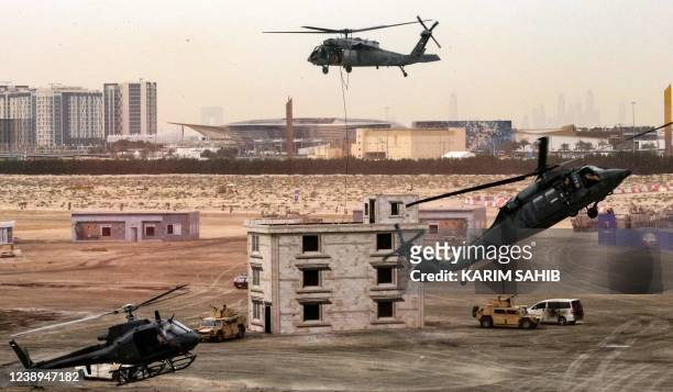Soldiers and military helicopters from the United Arab Emirates Armed Forces demonstrate their skills during the Union Fortress 8 military...