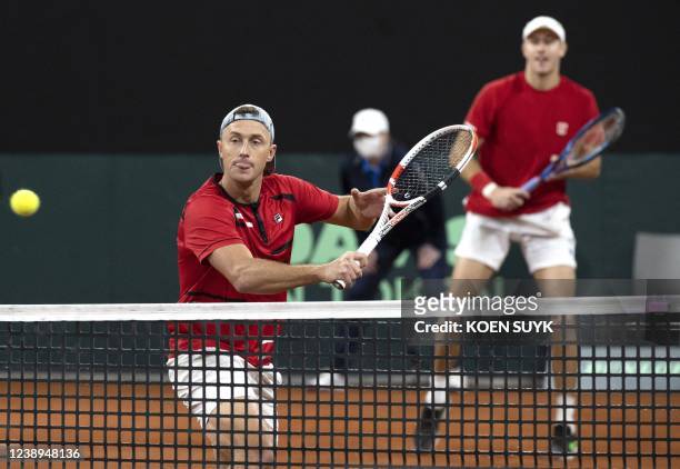 Peter Polansky and Brayden Schnur of Canada in action during their Davis Cup match against Wesley Koolhof and Matwe Middelkoop of the Netherlands,...