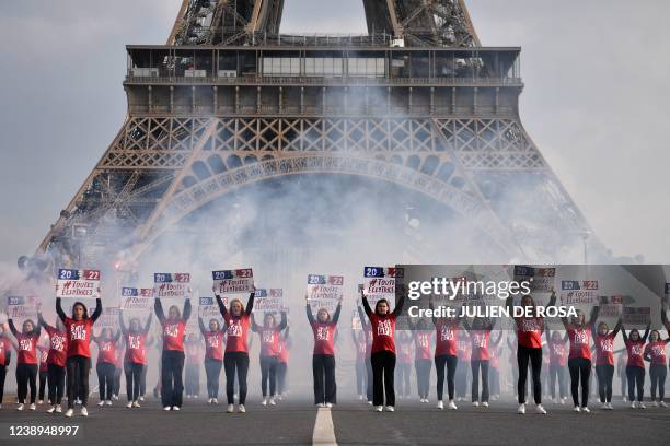 Members of the conservative activist group called Manif pour Tous stage a protest against surrogacy near the Eiffel Tower in Paris on March 5 on the...