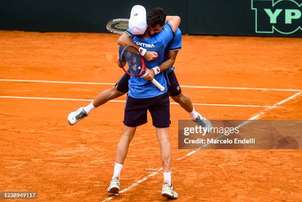 Horacio Zeballos of Argentina celebrates with teammate Maximo Gonzalez after winning their doubles match against Jiri Lehecka and Tomas Machac of...