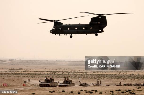 Boeing CH-47 Chinook helicopter and armoured personnel carriers from the United Arab Emirates Armed Forces demonstrate their skills during the Union...
