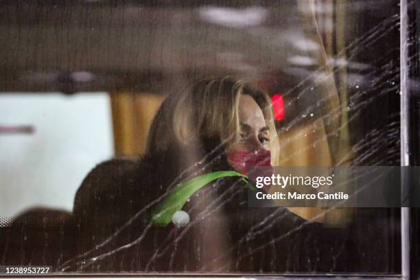 Ukrainian woman looks out of the window of a bus, loaded with Ukrainian refugees fleeing the war after the Russian invasion, arriving at the...