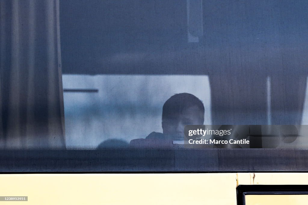 A Ukrainian child looks out of the window of a bus, loaded...