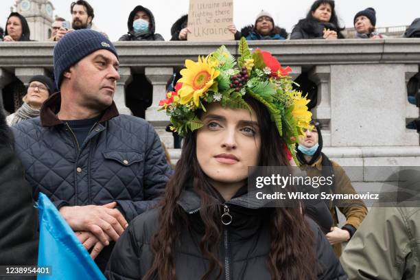 Woman wears a floral crown as Ukrainian people and their supporters demonstrate in Trafalgar Square calling on the British government to support...