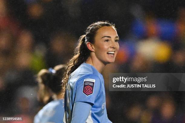 Manchester City's Scottish midfielder Caroline Weir celebrates after scoring her team third goal during the English Women's League Cup Final football...