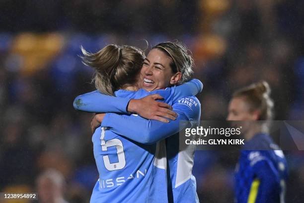 Manchester City's English defender Alex Greenwood and Manchester City's Australian defender Alanna Kennedy celebrate after winning at the end of the...