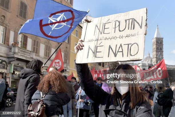 Girl with a placard, neither with Putin nor with NATO takes part in the national demonstration against the war in Ukraine and against all wars...