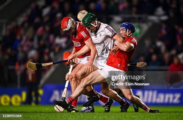 Cork , Ireland - 5 March 2022; Gavin Lee of Galway is tackled by Daire OLeary, left, and Sean ODonoghue of Cork during the Allianz Hurling League...
