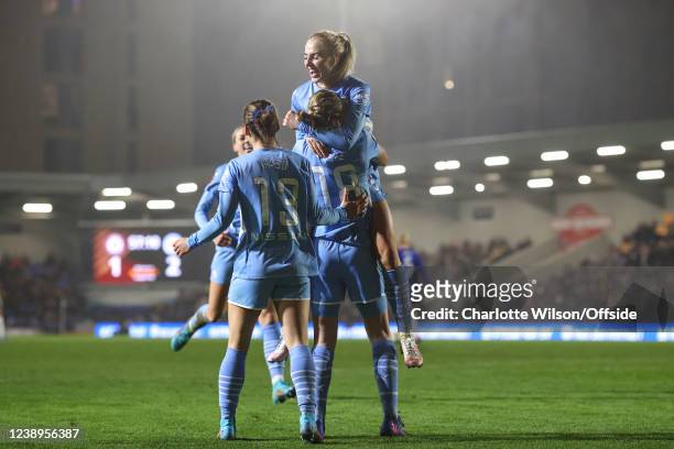 Alex Greenwood of Man City jumps on goalscorer Ellen White as they celebrate their 2nd goal during the FA Women's Continental Tyres League cup final...