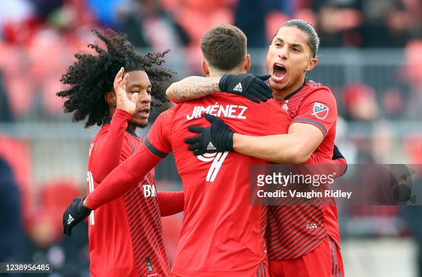 Jesus Jimenez of Toronto FC celebrates his goal with Carlos Salcedo during the first half of an MLS game against New York Red Bulls at BMO Field on...