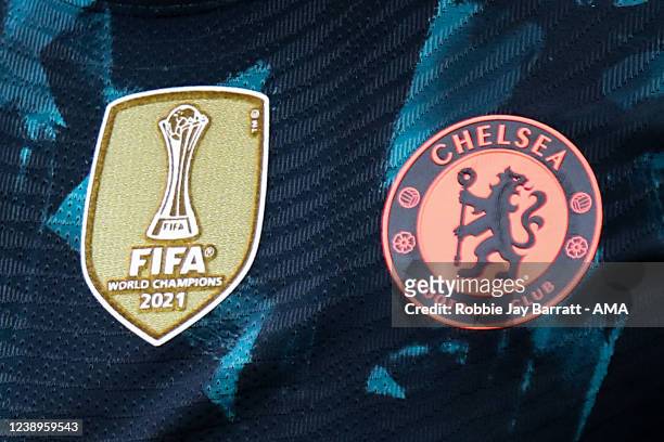 World Champions patch is seen next to a Chelsea club badge during the Premier League match between Burnley and Chelsea at Turf Moor on March 5, 2022...