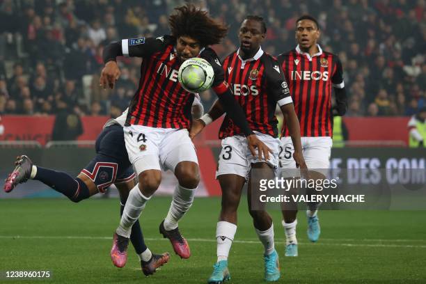 Nice's Brazilian defender Dante is challenged past Nice's Brazilian defender Robson Bambu and Nice's French defender Jean-Clair Todibo during the...