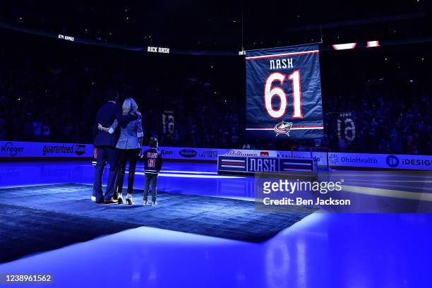 Former Columbus Blue Jackets forward Rick Nash and his family watch as his jersey is raised into the rafters during his jersey retirement night prior...