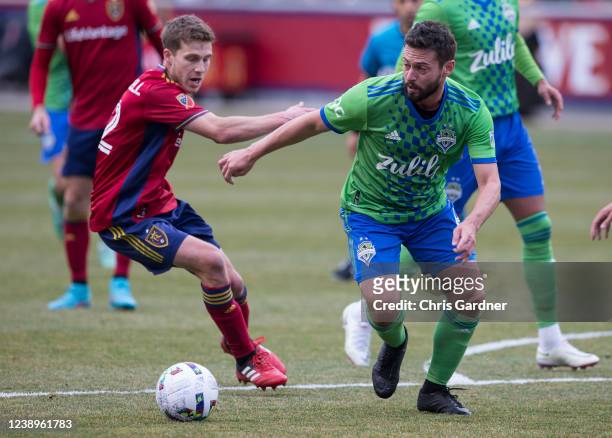 Scott Caldwell of Real Salt Lake chases Joao Paulo of the Seattle Sounders during the first half of their game March 5, 2022 at the Rio Tinto Stadium...