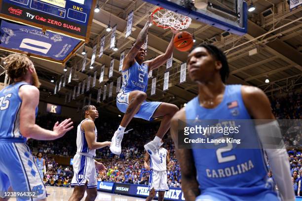 Armando Bacot of the North Carolina Tar Heels reacts following a dunk against the Duke Blue Devils at Cameron Indoor Stadium on March 5, 2022 in...