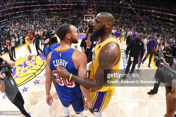LeBron James of the Los Angeles Lakers hugs Stephen Curry of the Golden State Warriors after the game on March 5, 2022 at Crypto.Com Arena in Los...