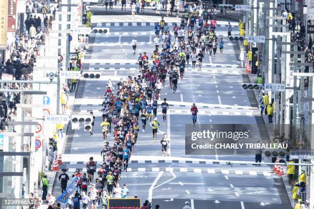 Athletes take part in the Tokyo Marathon 2021 in the Japanese capital city on March 6, 2022.