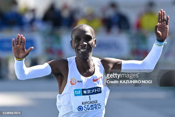 Kenya's Eliud Kipchoge crosses the finish line to win the men's category in the Tokyo Marathon in Tokyo on March 6, 2022.