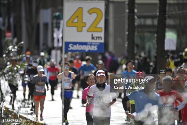 Participants compete during the Tokyo Marathon 2021 at the streets of Tokyo, Japan on March 6, 2022. Due to COVID-19, the Tokyo Marathon 2021 was...