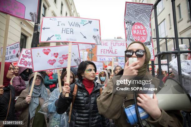 Women gathering outside Charing Cross Police Station during the rally in support of womens rights and against male violence in the streets of central...