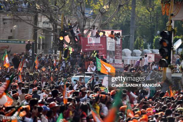 In this picture taken on March 4 India's Prime Minister Narendra Modi gestures during a road show ahead of seventh phase of the Uttar Pradesh state...