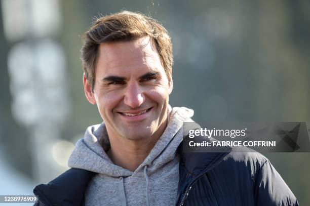 Former men's tennis world number one Swiss Roger Federer speaks at the arrival area of the Women's giant slalom event at the FIS Alpine Ski World Cup...