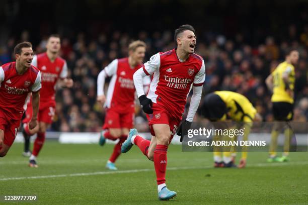 Arsenal's Brazilian striker Gabriel Martinelli celebrates after scoring his team third goal during the English Premier League football match between...