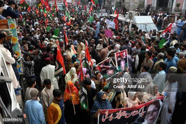 Activists of Pakistan Peoples Party gather on the arrival of party's chairman Bilawal Bhutto Zardari during an anti-government march in Lahore on...