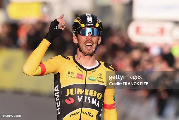 Jumbo-Visma's French rider Christophe Laporte celebrates as he crosses the finish line to win the 1st stage of the 80th Paris - Nice cycling race,...