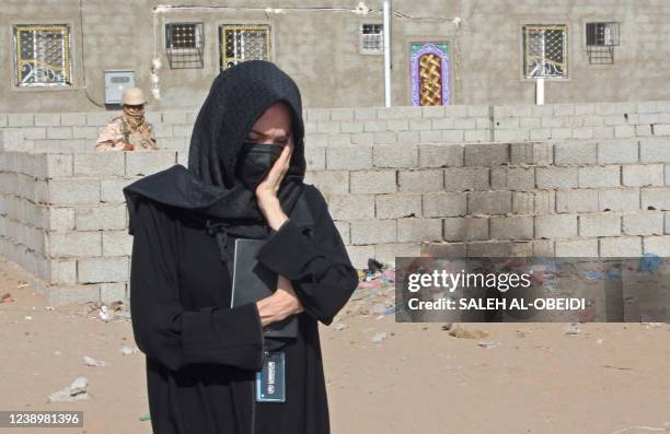 United Nations High Commission for Refugees special envoy Angelina Jolie reacts at a camp for the internally displaced north of Yemen's southern city...