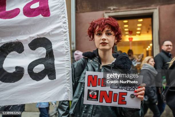 Protesters with feminist, pro-choice banners and anti Russia against Ukraine war banners are seen in Gdansk, Poland on 6 March 2022 The Manifa is...