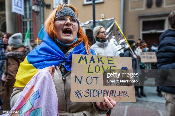 Protesters with feminist, pro-choice banners and anti Russia against Ukraine war banners are seen in Gdansk, Poland on 6 March 2022 The Manifa is...